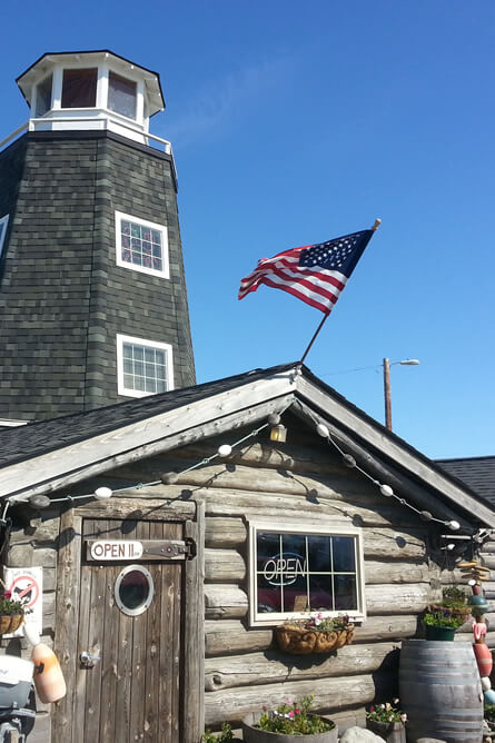 Depicts exterior of a local pub, which is a landmark and a famous tourist attraction.